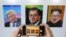A visitor takes a photograph of images, from left, of U.S. President Donald Trump, South Korean President Moon Jae-in and North Korean leader Kim Jong Un during an exhibition at an annex of the presidential Blue House in Seoul, South Korea, Jan. 3, 2019. 