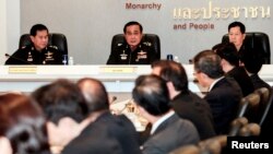 Thai Army chief General Prayuth Chan-ocha speaks during a meeting with Thai ambassadors at the Royal Thai Army Headquarters in Bangkok, June 11, 2014.