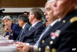 From left, Secretary of State John Kerry, Treasury Secretary Jacob Lew, Defense Secretary Ash Carter, Energy Secretary Ernest Moniz and Joint Chiefs Chairman Gen. Martin Dempsey testify on Capitol Hill in Washington, July 29, 2015.