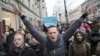 FILE - In this Sunday, Jan. 28, 2018 file photo, Russian opposition leader Alexei Navalny, center, attends a rally in Moscow, Russia. (AP Photo/Evgeny Feldman, File)