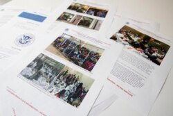 A portion of a report from government auditors reveals images of people penned into overcrowded Border Patrol facilities, photographed, July 2, 2019, in Washington.