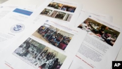 A portion of a report from government auditors reveals images of people penned into overcrowded Border Patrol facilities, photographed, July 2, 2019, in Washington.