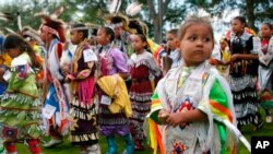 FILE: Four-year-old Bobby Morris of Wisconsin Dells, Wis.,at the Prairie Island Dakota Wacipi Celebration Pow Wow near Red Wing., Minn., on July 11, 2003.