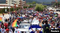 Demonstrators take part in a march against Honduran President Juan Orlando Hernandez, in Tegucigalpa, Aug. 6, 2019.