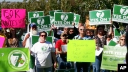 FILE - Supporters of Arkansas Issue 7, a medical marijuana initiative that would have allowed patients with certain conditions an opportunity to obtain or grow marijuana to ease their symptoms, rally outside the Arkansas Supreme Court building in Little Rock, Oct. 28, 2016.