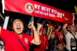 Supporters of Myanmar's National League for Democracy party cheer as election results are posted outside the NLD headquarters in Yangon, Myanmar, Nov. 9, 2015.