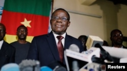 FILE - Maurice Kamto, a presidential candidate of Renaissance Movement (MRC), holds a news conference at his headquarter in Yaounde, Cameroon, Oct. 8, 2018. 