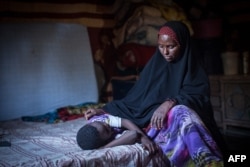 FILE — Amran Mahamood used to circumcise young girls in Hargeysa, Somalia, but stopped after a religious leader convinced her the rite was not required by Islamic law.
