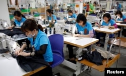 Laborers work at export garment Maxport factory in Hanoi, Vietnam, March 20, 2019.