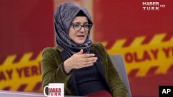 In this image from TV, Hatice Cengiz, who is Turkish, reacts during an interview on Turkish television channel HaberTurk, Oct. 26, 2018, about the day her fiance, Saudi journalist Jamal Khashoggi entered the Saudi Arabia Consulate on Oct. 2, and was killed inside.
