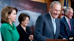 Senate Minority Leader Chuck Schumer of New York, accompanied by Sen. Ed Markey, D-Mass., right, Rep. Anna Eshoo, D-Calif., second from left, and House Minority Leader Nancy Pelosi of California, left, speak to reporters on Capitol Hill in Washington, May 16, 2018, after the Senate passed a resolution to reverse the FCC decision to end net neutrality.