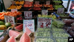 A fruit stall displays fruit at a market in London, Wednesday, Aug. 7, 2019. The U.K. food industry is asking the government to set aside competition rules so companies can coordinate supply decisions to combat shortages in the event Britain leaves…