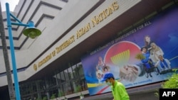 A gardener trims plants in the courtyard of the Association of Southeast Asian Nations (ASEAN) secretariat building in Jakarta, April 20, 2021, ahead of the ASEAN Summit on April 24.