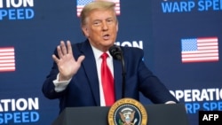 FILE - U.S. President Donald Trump speaks in the Eisenhower Executive Office Building adjacent to the White House in Washington, Dec. 8, 2020.