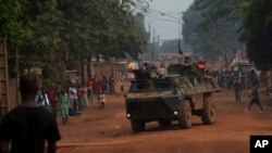 French soldiers drive through the Miskine neighborhood of Bangui, Central African Republic, Dec. 26, 2013.