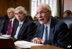 FILE - Former National Security Adviser Brent Scowcroft (R) speaks on Capitol Hill in Washington, April 9, 2013.