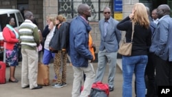 FILE - Aid workers from various NGOs active in South Sudan arrive at Wilson airport in Nairobi, Kenya, July 13, 2016, from Juba.