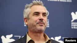 Mexican film director Alfonso Cuaron, a member of the jury at the 72nd Venice Film Festival, poses during a photo call for the event in Venice, Italy, Sept. 2, 2015.
