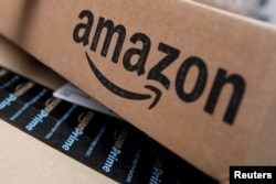FILE - Amazon boxes are seen stacked for delivery in the Manhattan borough of New York City.