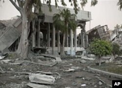 In this photo made on a government organized tour, buildings destroyed in a NATO airstrike are seen in Tripoli, Libya, April 25, 2011