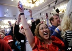 Supporters cheer during a caucus night rally for Republican presidential candidate Donald Trump, Feb. 23, 2016.