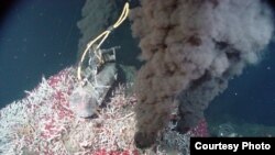 A hydrothermal vent emits jet-black smoke. This material is usually made of minerals that solidify and form chimneys on the sea floor. However, hydrogen can also be a byproduct of vents. (Photo courtesy of National Oceanic and Atmospheric Administration) 
