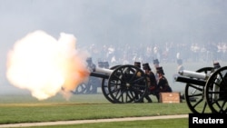 Members of The King’s Troop Royal Artillery fires a round during the 41 Gun Royal Salute marking the 96th birthday of Britain’s Queen Elizabeth, in Hyde Park, London, April 21, 2022.