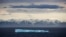 FILE - An iceberg floats past Bylot Island in the Canadian Arctic Archipelago, July 24, 2017.