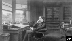 Charles Dickens in his office