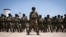 FILE - Mozambican soldiers stand in formation in Pemba, Cabo Delgado province, Mozambique, Sept. 24, 2021.