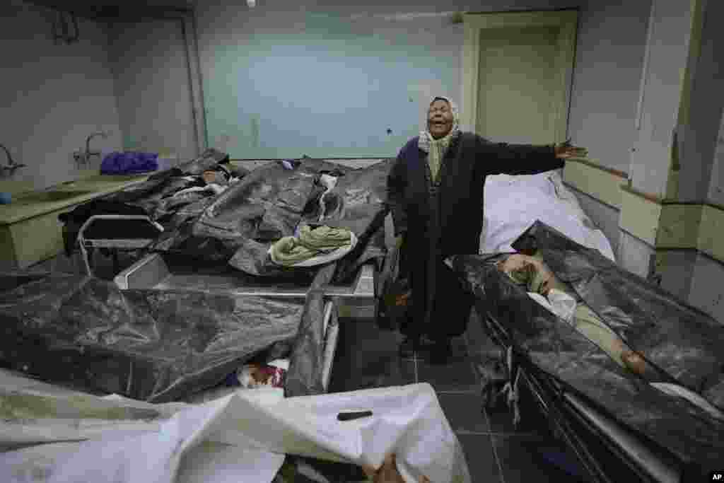  Hilala Meryeh, a 64-year-old Palestinian mother of four, weeps in the middle of the dingy identification room after finding her son's body at the Al-Mojtahed Hospital morgue in Damascus, Syria, Dec. 11, 2024. 