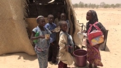 FILE - Children getting their meal in front of a school in Bosso, Diffa region, Niger, April 19, 2017. (Nicolas Pinault/VOA)