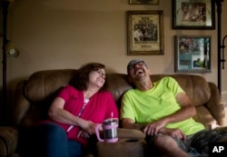 Jeff McCoy, right, a recovering opioid addict, laughs with his wife JoAnne at their home in Dickson, Tennessee, June 7, 2017. Now, he says his wife is his addiction. "She's my everything, she's my drug."