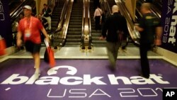 Hackers and security personal attend the Black Hat hacker conference on July 31, 2013, in Las Vegas. 