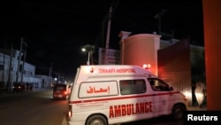FILE - An ambulance carrying an injured person from an attack by al-Shabab gunmen on a hotel near the presidential residence arrives at Shaafi hospital in Mogadishu, Somalia, Dec. 10, 2019. 