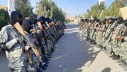 Taliban border fighters attend their graduation ceremony after a three-week training program in Lashkar Gah, Helmand province, Afghanistan, Oct. 25, 2021.