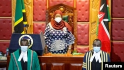 FILE - Tanzanian President Samia Suluhu Hassan (C) arrives to address a joint Parliament session of Kenyan Members of Parliament and Senators in Nairobi, Kenya, May 5, 2021. 