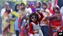 A girl dances as she takes part in celebrations after learning the initial results inside the residence of Janata Dal (United) leader Sharad Yadav in New Delhi, India.