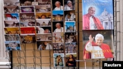 Postcards and calendars are displayed outside a shop at the Vatican, February 12, 2013.