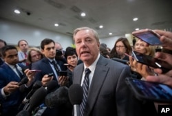 FILE - Sen. Lindsey Graham, R-S.C., chairman of the Subcommittee on Crime and Terrorism, speaks to reporters after a closed-door security briefing by CIA Director Gina Haspel on the slaying of Saudi journalist Jamal Khashoggi.
