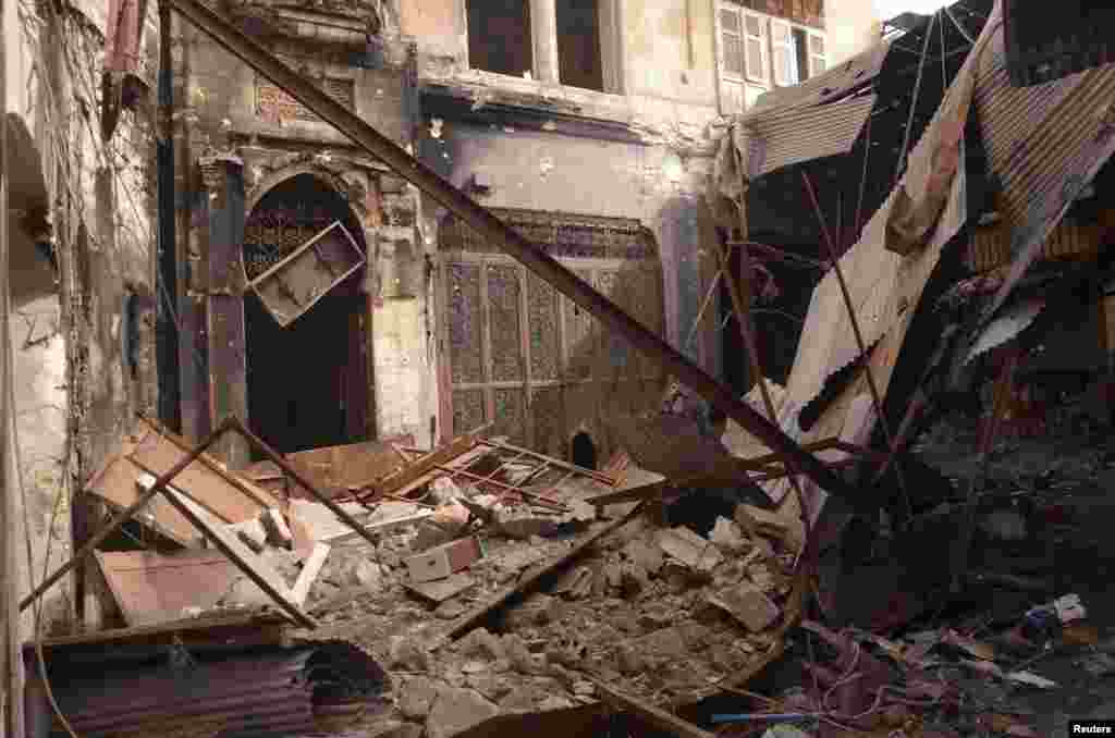 Destruction and debris are seen in Al-Suwayqa, Aleppo after forces loyal to Syrian President Bashar al-Assad captured the area from the Free Syrian Army, Feb. 25, 2013. 