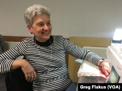 Linda Ebersole, of Rock Falls, Ill., takes a break from her weeking sewing gathering at the Fulton Community Center in Fulton, Ill.