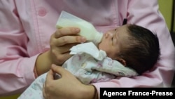 This photo taken on Jan. 19, 2019, shows a member of the medical staff taking care of a new born baby at a hospital in Fuyang in China's eastern Anhui province.