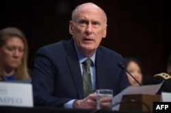 FILE - Director of National Intelligence Dan Coats testifies on worldwide threats during a Senate Intelligence Committee hearing on Capitol Hill in Washington, Feb. 13, 2018.
