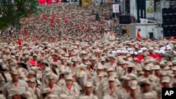 Este grupo armado al que se incorporan civiles fue creado por Hugo Chávez y es una rama de las Fuerzas Armadas del país. La celebración ocurre en medio de una creciente tensión y protestas en el país desde finales de marzo.