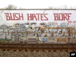 A tagger who called himself Borf gave Cool Disco Dan a run in the mid-2000s. Someone - likely not Borf since the style looked different - changed Bush to Obama recently.