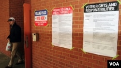 People have been voting across the country all day. Soon, the ballot counting will begin. Posters near polling provide information about voting, Arlington, Virginia, November 6, 2012. (Dimitris Manis/VOA)