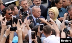 Turkish President Tayyip Erdogan leaves a polling station in Istanbul, June 24, 2018.