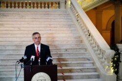 FILE - Georgia Secretary of State Brad Raffensperger speaks during a news conference in Atlanta, Georgia, Nov. 30, 2020.
