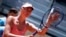 FILE - Russian tennis player Maria Sharapova touches her racket at the end of her match against Colombian Mariana Duque Marino in Madrid, May 5, 2015. 